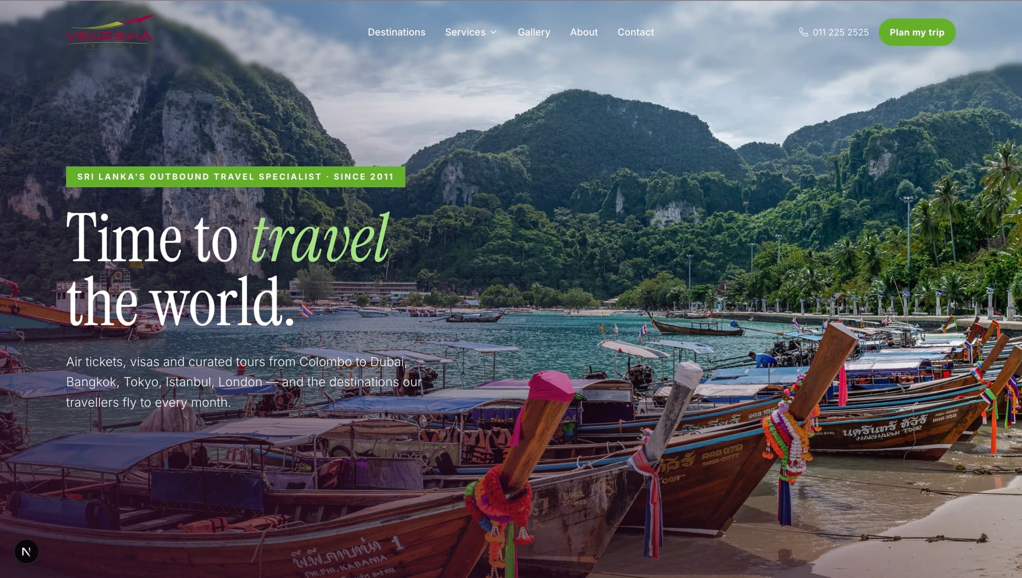 Yenesha Travels homepage hero — 'Time to travel the world.' over long-tail boats moored in a limestone bay